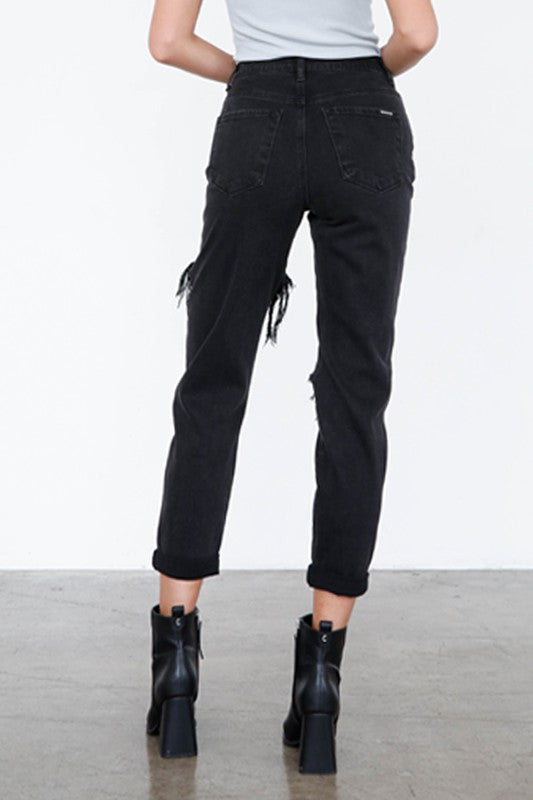 Back view of trendy black ripped jeans by Insane Gene featuring a high waist and cuffed hem.