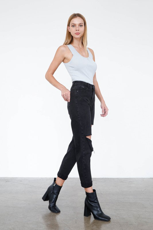 Trendy black ripped jeans from Insane Gene styled with a light tank top and ankle boots