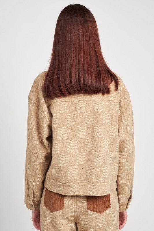 Back view of a stylish Emory Park trendy travel jacket in a soft beige pattern