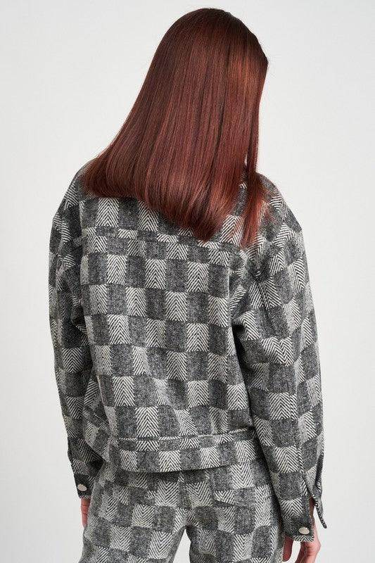 Emory Park trendy travel jacket in a black and gray checkered pattern for stylish comfort on the go